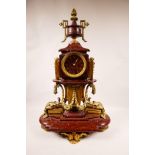 A C19th French ormulu and rouge marble mantel clock with an Auguste Lemaire movement, the dial