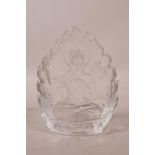 A Sino-Tibetan pressed glass shrine depicting Buddha seated on a lotus throne, 5" high