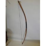 A hand crafted longbow, 58" long