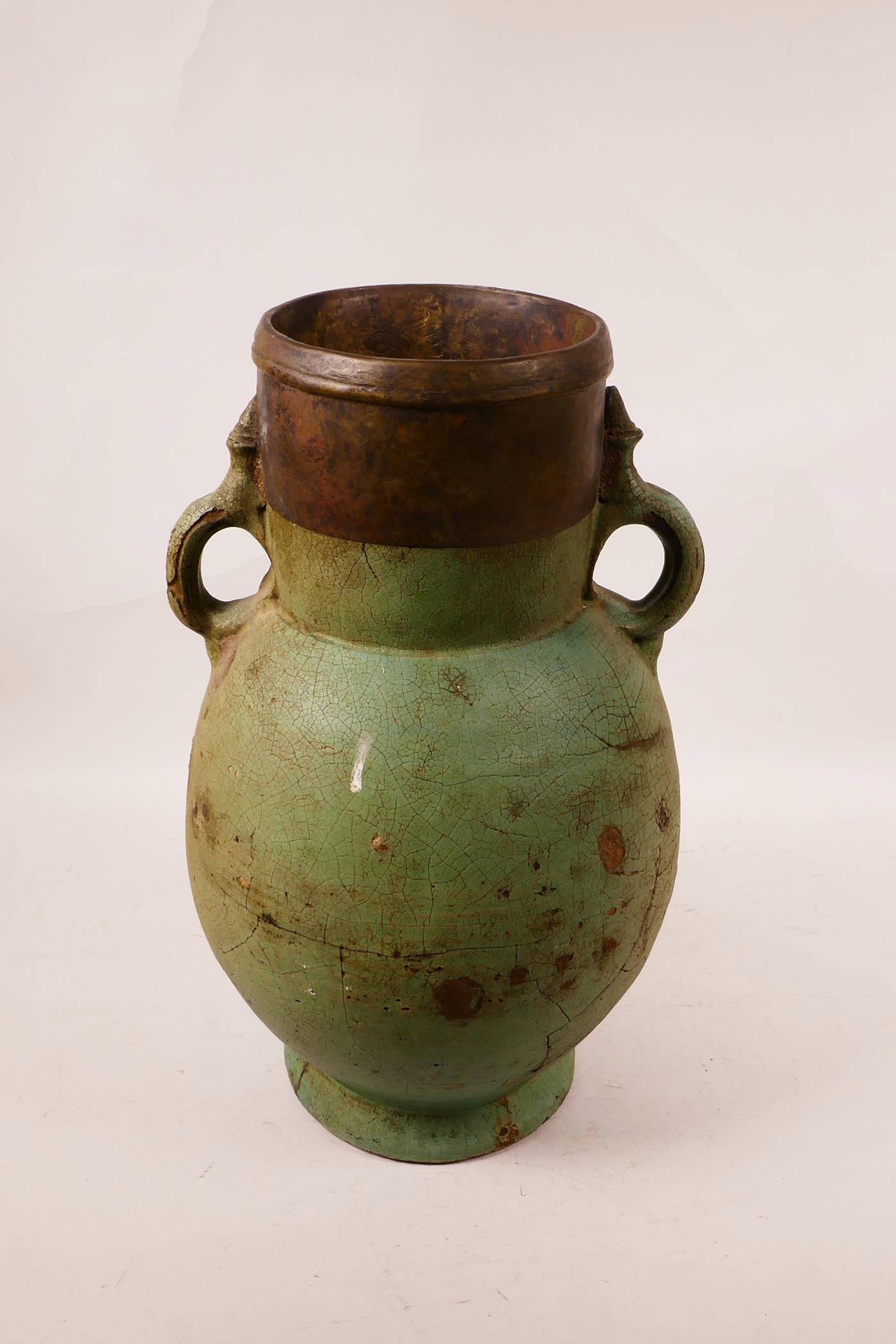 An Eastern pottery two handled vase with a turquoise glaze and copper rim, probably Indian, repair - Image 2 of 6