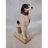 A large mid century ceramic seated dog, possibly a pointer, well cast and decorated, 32" x 15½" x 8"
