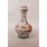 A Chinese polychrome porcelain garlic head shaped vase with enamelled decoration of a dragon chasing