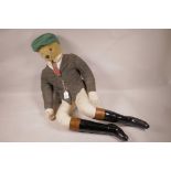 A mid C20th seated teddy dressed as a jockey, 32" high