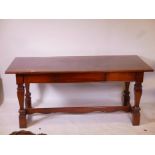 A mahogany three drawer refectory style desk with a leather inset top, 69½" x 30½" x 30" high