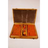 A Bakelite mahjong set, cased, 15" x 10"