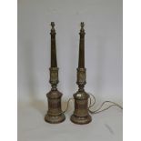 A pair of brass table lamps with repoussé classical decoration, 34" high