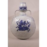A Chinese blue and white porcelain two handled moon flask decorated with two kylin, 6 character mark