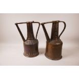 Two antique Sudanese copper pourers, 12" high