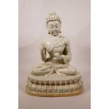 A Chinese celadon glazed pottery figure of Buddha seated on a lotus throne, 14" high