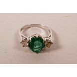 An 18ct white gold, emerald and diamond ring, approximate size 'O'