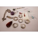 A quantity of miscellaneous jewellery including amber drop earrings, pendants, silver rings etc