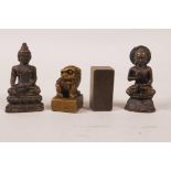 Two Sino-Tibetan miniature bronze Buddhas, together with two Chinese miniature bronze seals, largest