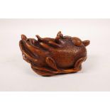 A Chinese carved boxwood brush wash in the form of the Buddha's hand citrus fruit, 4½" long