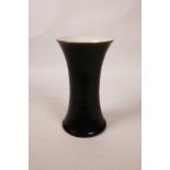 A Chinese black glazed porcelain vase of waisted form, 7" high