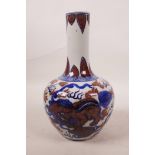 A Chinese blue, white and red porcelain bottle vase with kylin decoration, 4 character mark to base,