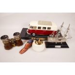 A 1962 Volkswagen minibus display model, 9" long, together with a metal model sailing ship, an