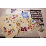 A quantity of world postage stamps including album sheets, specimens, first day covers etc