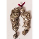 A pair of Chinese white metal figural rattles with attached bells, 3" long