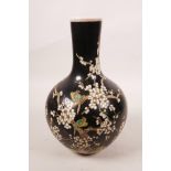A Chinese famille noire porcelain vase decorated with birds amongst prunus blossom, 6 character mark