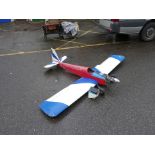 A large remote control model airplane, 76½" long, 102" wingspan