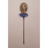 A Chinese white metal hair pin with enamelled bat decoration, set with a jade carving to end, 5½"