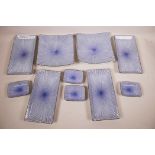 A Japanese blue and white porcelain ten piece hors d'oeuvres set decorated with a radiating