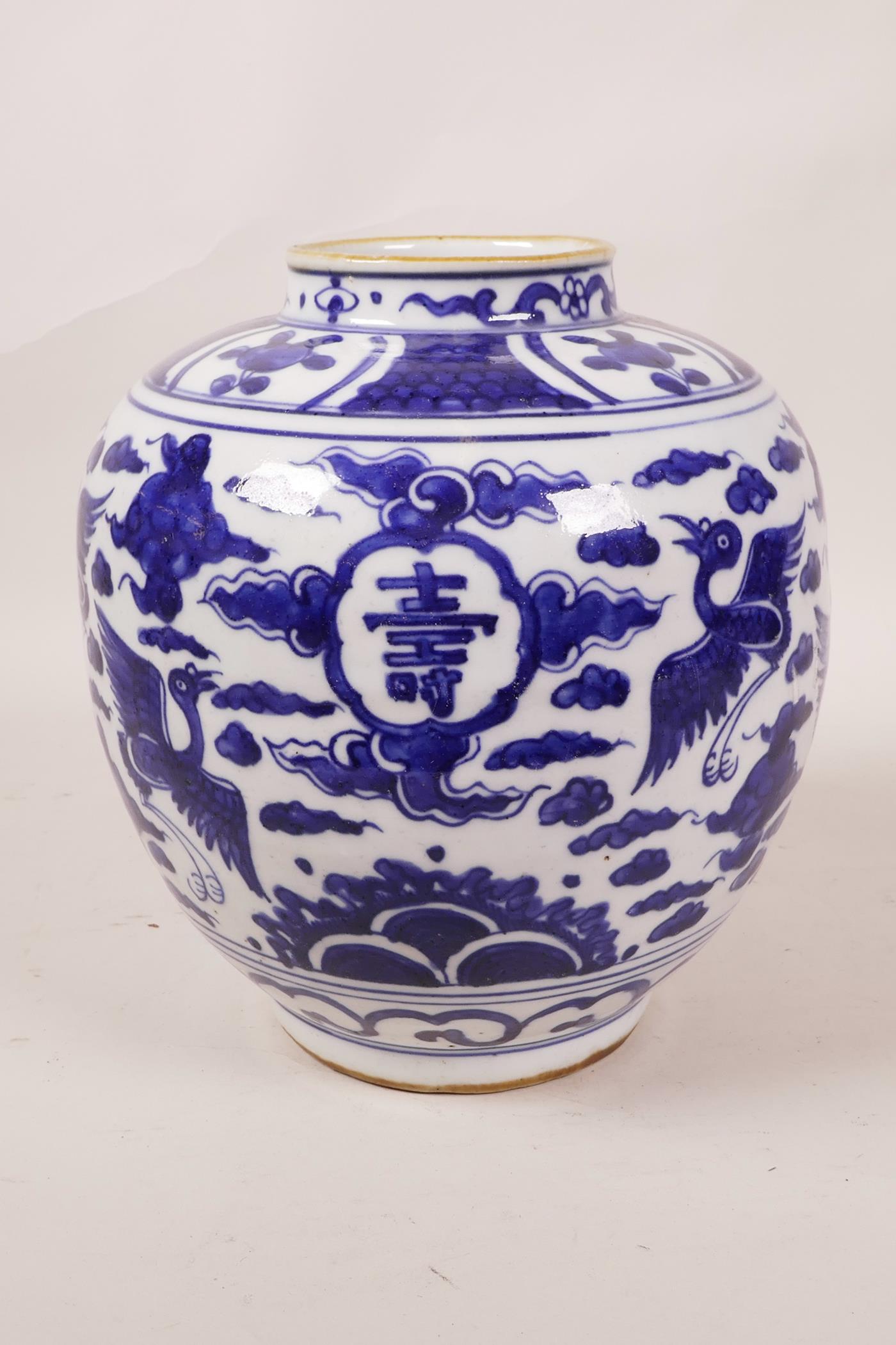 A Chinese blue and white porcelain ginger jar decorated with cranes in flight and auspicious - Image 2 of 5