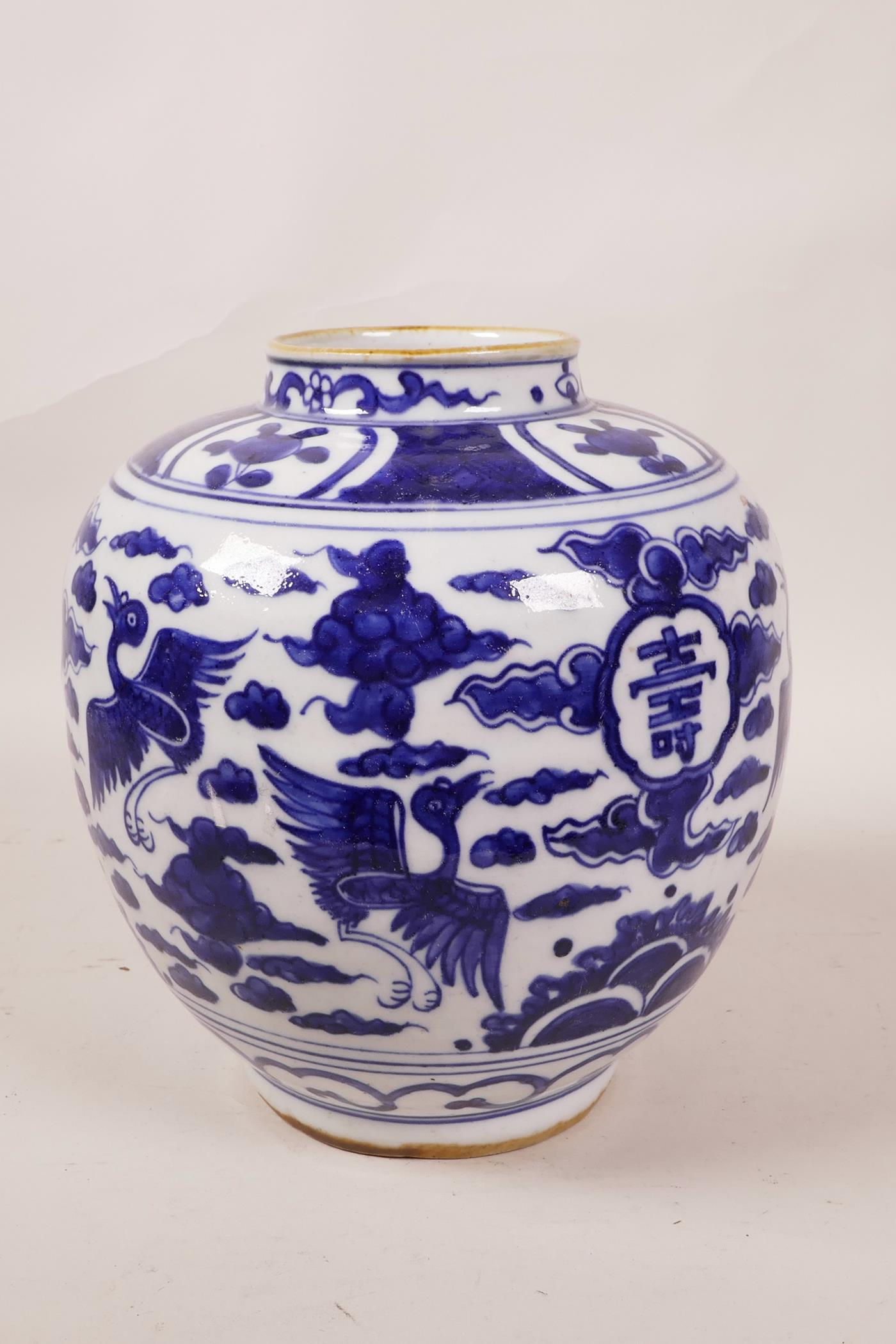 A Chinese blue and white porcelain ginger jar decorated with cranes in flight and auspicious - Image 3 of 5