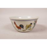 A Chinese doucai porcelain tea bowl with chicken decoration, 6 character mark to base, 3" diameter