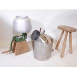 A Lister canted milk pail, a rustic elm milking stool and an 'Alfa Laval' cast iron cream separator,