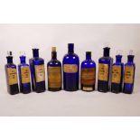 A quantity of antique blue glass apothecary bottles, one A/F