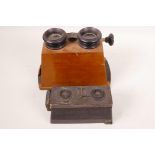 A vintage Le Glyphoscope stereoscopic camera/viewer together with a mahogany stereoscopic viewer