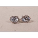 A pair of 18ct white gold, aquamarine and diamond stud earrings