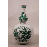 A Chinese double gourd porcelain vase with green enamel dragon and phoenix decoration, seal mark
