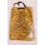 A Tibetan lacquered bone panel with chased decoration of Buddha, 5½" x 6½"
