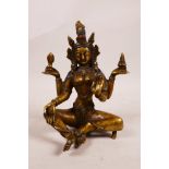 A Tibetan bronze figure of a four armed goddess, with enamelled details, 6½" high