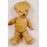 An antique plush teddy bear (well loved), 16" tall