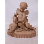 After Lebroc, a painted terracotta figure group of a putto and dove, 23" high