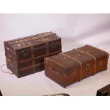 A dome top steamer trunk, with oak straps and metal mounts, 34" x 21" x 20", and another