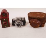 A Coronet Midget camera in red Bakelite case together with a Japanese H.I.T. miniature camera in