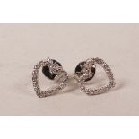 A pair of 18ct white gold, heart shaped diamond earrings