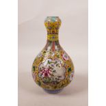 A Chinese polychrome porcelain garlic head shaped vase, with floral decoration on a yellow ground, 4