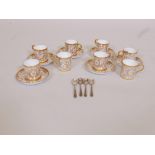 A Minton part coffee set with gilt decoration and four hallmarked silver spoons, A/F two saucers