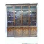 A Regency style flame mahogany breakfront bookcase, 80" x 15½, 84½" high