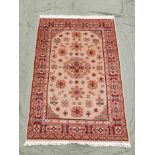A beige ground Caucasian rug with traditional design, 51" x 76"