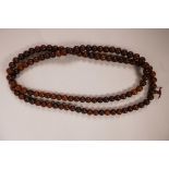 A string of horn beads, 58" long