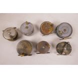 A collection of vintage brass and aluminium trout fishing reels, including reels by 'Arthur Allen of