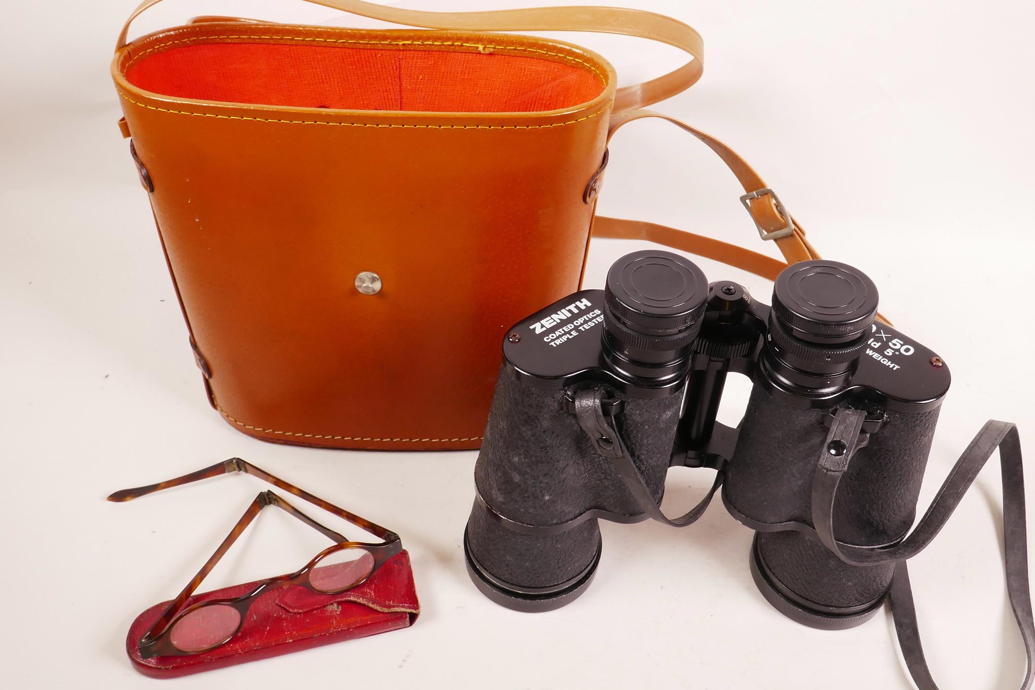 A pair of Zenith 10X50 lightweight field binoculars, coated lenses triple tested, with leather case;