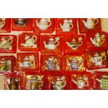 Seventy-seven porcelain art miniature teapots, special edition, beautifully decorated and still