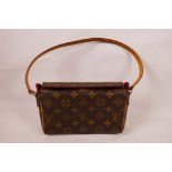 A lady's Louis Vuitton style clutch bag, 8½" wide